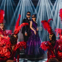 We brought the drama for Aashvi and Akash's masquerade night. The theme was midnight elegance, and we delivered with a custom deep purple velvet tuxedo for the groom and a stunning, color-coordinated structured gown for the bride. The custom masks were the perfect finishing touch for an enchanting evening.