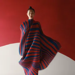 For the same Payal Khandwala campaign, we used bold color blocking. The sculptural, pleated textile in red and blue creates a powerful silhouette against the minimalist set.
