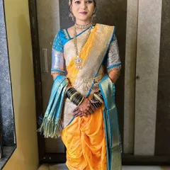 Draping a Nauvari saree is an art in itself. Here, I have styled my client in a traditional yellow and blue Nauvari, ensuring the drape is perfect and comfortable, allowing her to move with grace during her saptapadi ceremony.
