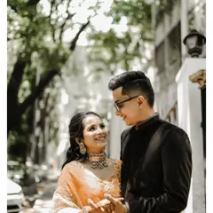 A beautiful outdoor portrait of a young couple from their ring ceremony, sharing a loving gaze.