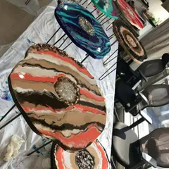 The beautiful results of a geode coffee table workshop. All these colorful and unique tabletops are drying after being created by students during one of my group sessions.
