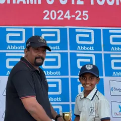 Celebrating individual contributions to a team victory. A player from my U-12 squad receives his award after our final win in the Little Champs Tournament.