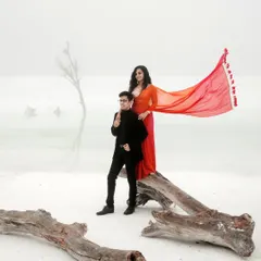 We love discovering surreal landscapes for our couples. Here, in the stark white marble quarries near Udaipur, a vibrant red gown creates a breathtaking contrast, turning a pre-wedding portrait into a piece of high-fashion art.