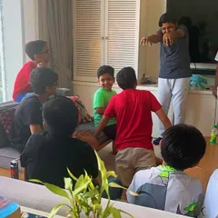 My students enjoying some fun and games during a Christmas party. These informal gatherings are a great way for everyone to connect and build friendships outside of our regular coding classes.