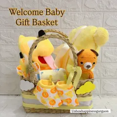 I call this my "Bundle of Sunshine" basket, designed to bring a warm welcome to any newborn. This gender-neutral gift set includes a cheerful Pluto soft toy, a hand-knitted tiger, and a matching set of soft cotton booties and essentials.