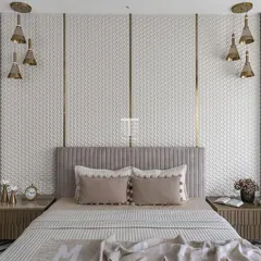This bedroom features intricate 3D paneling behind the bed, creating a stunning focal point. We crafted the fluted bed and matching bedside tables to complement the detailed wall, resulting in a space that is rich in texture and sophistication.