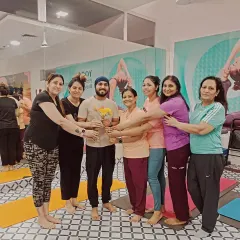 A guru is not just a teacher, but a torchbearer. This picture, taken on Guru Purnima, captures the love and respect that defines our yoga family.