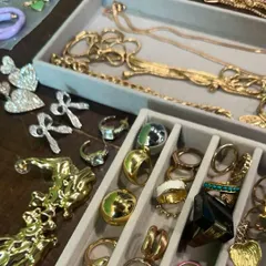 The finishing touches are everything. A look inside my accessory kit on a shoot day, filled with a variety of gold chains, statement rings, and bold earrings to complete each outfit.
