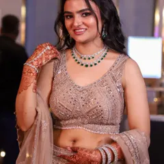 A happy and radiant engagement look. Her smile says it all. The makeup is designed to look fresh and glowing, perfect for celebrating this special milestone.