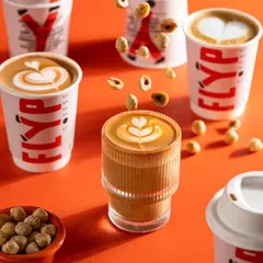 A playful shot for Flyp Coffee, featuring levitating hazelnuts. This dynamic composition adds a sense of fun and energy to the coffee, making the brand feel fresh and modern.