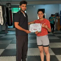 Posing with Saniya and her gold medal and certificate. She was also named the best boxer in the senior women's category.
