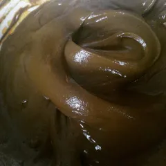 This is my therapy. The swirl in the henna paste shows its perfect, silky texture. I never use chemicals, only pure henna powder and essential oils.