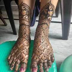 Bridal mehndi isn't just for the hands. I create equally detailed and beautiful designs for the feet, ensuring a complete and stunning bridal look. This design features dense jaal work covering the entire foot, finished with delicate floral patterns.