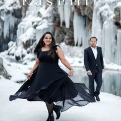 A playful twirl in a black dress against the dramatic icy backdrop of Kashmir. This shot highlights the contrast and beauty of a destination pre-wedding session.