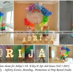 A vibrant rainbow theme for a fifth birthday. The decor includes a circular backdrop with a rainbow, a colorful balloon arch, and marquee letters, creating a cheerful and bright atmosphere.