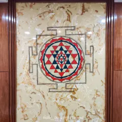 The Sri Chakra mural installed in a residence's pooja space. Painting on this smooth, glossy surface was a challenge, but the result is a sharp and powerful spiritual centerpiece.