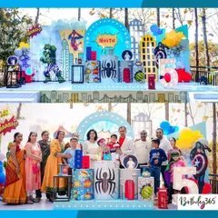 An epic superhero party for Nihith's 5th birthday. This outdoor setup featured a dynamic city backdrop, character cutouts including the Hulk and Spider-Man, and a large light-up number "5".
