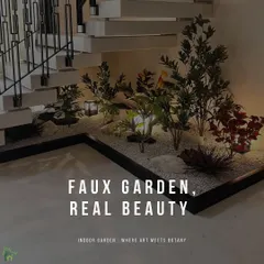A diverse collection of artificial plants, including leafy greens and pops of red, creates a vibrant faux garden under a floating staircase. Set in a bed of white gravel with integrated lanterns, this design adds life and color to the space.