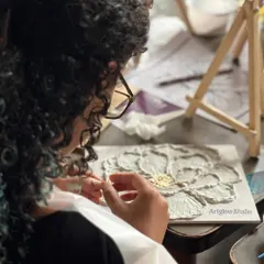 A participant carefully adding details to her textured flower. It’s a process that requires patience but is incredibly rewarding.