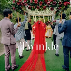 A vision in red. The bride's entry under a lush 'phoolon ki chadar' is a timeless moment of grace and tradition.