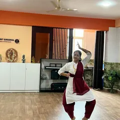 A student demonstrates a dynamic Bharatanatyam pose during an exam session. Our training focuses on achieving precision in posture and expression.