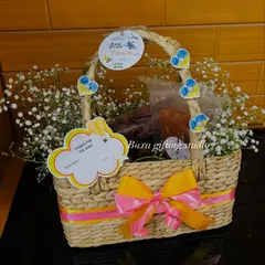 My handwoven Kauna grass baskets are an eco-friendly and elegant option for any occasion, shown here decorated for a baby announcement.