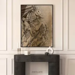 This artwork features a digitally illustrated ancient stone carving of a horse and rider. The design captures the texture and detail of Indian temple architecture, presented as a framed piece for a modern space.