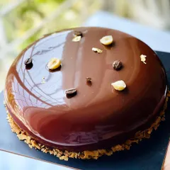 The glaze on this Coffee Hazelnut entremet is everything. The mirror-like shine is the perfect finish for such a decadent dessert.
