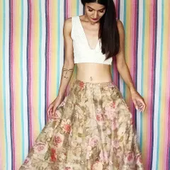 Here is a look that feels light and summery. I paired a hand-embroidered white Chikankari crop top with a flowing floral organza skirt. This is the kind of versatile Indo-western skirt set that you can dress up or down for any occasion.