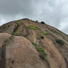 The rocky monolith of Uttari Betta, with patches of green, makes for a challenging and exciting climb.