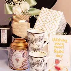 This Rakhi, surprise your sibling with a luxe white leatherette box. It's filled with everything they'd actually want, including matching mugs, lavender tea, a scented candle, and other self-care goodies.