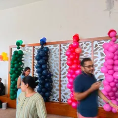 These vibrant, monochromatic balloon columns were designed for a "paint party" theme. Each column uses a different bold color, adding a fun and artistic element to the event space.