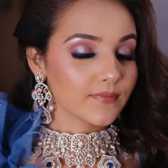 Another angle of this glamorous cocktail makeup, showing the blended eyeshadow with eyes closed. This highlights the seamless transition of colors and the radiant, dewy skin finish.