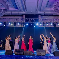 The full bride tribe on stage, perfectly in sync. I love creating these large group performances that showcase the power and unity of the bridesmaids.