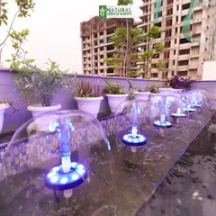 A close-up of the bubble jet fountain feature in our Sushant Lok project, with integrated blue LED lights that create a mesmerizing effect at night.