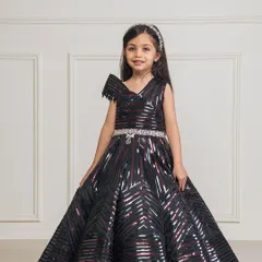 Our black taping gown features a modern, geometric pattern and a full ball gown skirt, perfect for a fashion forward princess.