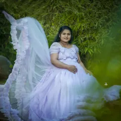 An ethereal solo portrait in a lavender gown with a dramatic, flying train. I use natural settings and creative posing to make you look and feel like a goddess.