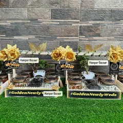 A full view of the Golden Jubilee anniversary hampers we created. Celebrating 50 years of love deserves something special, and these black and gold themed hampers were designed to be just that.