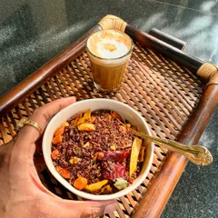 A bowl of homemade Ragi Chivda served with coffee, a perfect savory and crunchy afternoon snack.