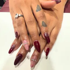This view shows the sharp, clean shape of the almond nail extensions and the high-gloss finish of the polish. Quality application ensures your nails look perfect from every angle.