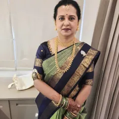 Another portrait of the groom's mother, looking poised and elegant for the Muhurtham. The makeup is natural and enhances her features without looking heavy.