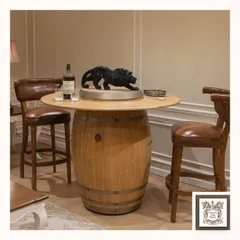 I designed this automated barrel bar for a more rustic, industrial feel. Crafted from a genuine wood barrel, the top rises to create a convenient and stylish serving station, perfect for a casual entertainment area.