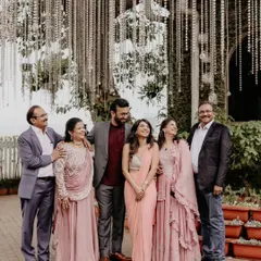 A perfect family portrait. Capturing the whole family together, sharing in the couple's happiness, is an essential part of the story.