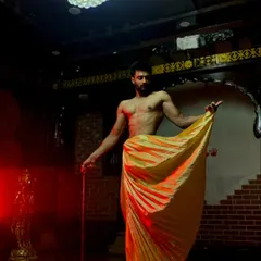 Another creative shot of the dhoti drape, showing the beautiful fan of the pleats. This style is perfect for grooms who want a majestic and unique look.