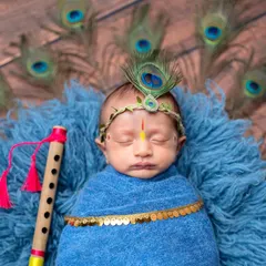 A close-up of our little Krishna, complete with a peacock feather crown and tilak. I pay close attention to every detail to make these cultural themes authentic and beautiful.