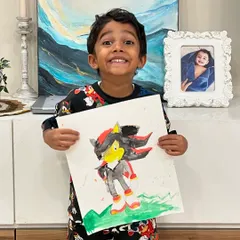 The excitement is real! He is so proud of his finished Sonic painting, and so am I!