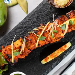I believe food should be both delicious and visually stunning. This Mango Paneer Tikka, artfully plated on a slate board, is a perfect example of how I elevate classic dishes with a modern, creative twist, making it an ideal starter for an executive lunch or a special company milestone.