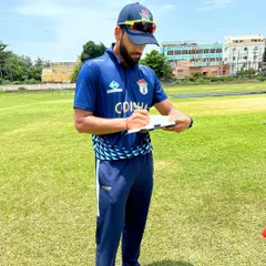 Documenting observations during a field session. Meticulous note-taking on athlete performance, fatigue levels, and movement quality is crucial for adjusting training loads and ensuring long-term development.