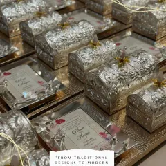 I believe a wedding invitation should be a keepsake. Here is a bulk order of our luxury brass invitations with a silver micron coating, each set on an elegant tray with a small chest. This is how you announce your special day with unparalleled grace.
