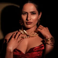 I love playing with shadows to create drama and depth. In this shot, the light carves out the model's features and highlights the texture of the velvet top, resulting in a bold and glamorous portrait.